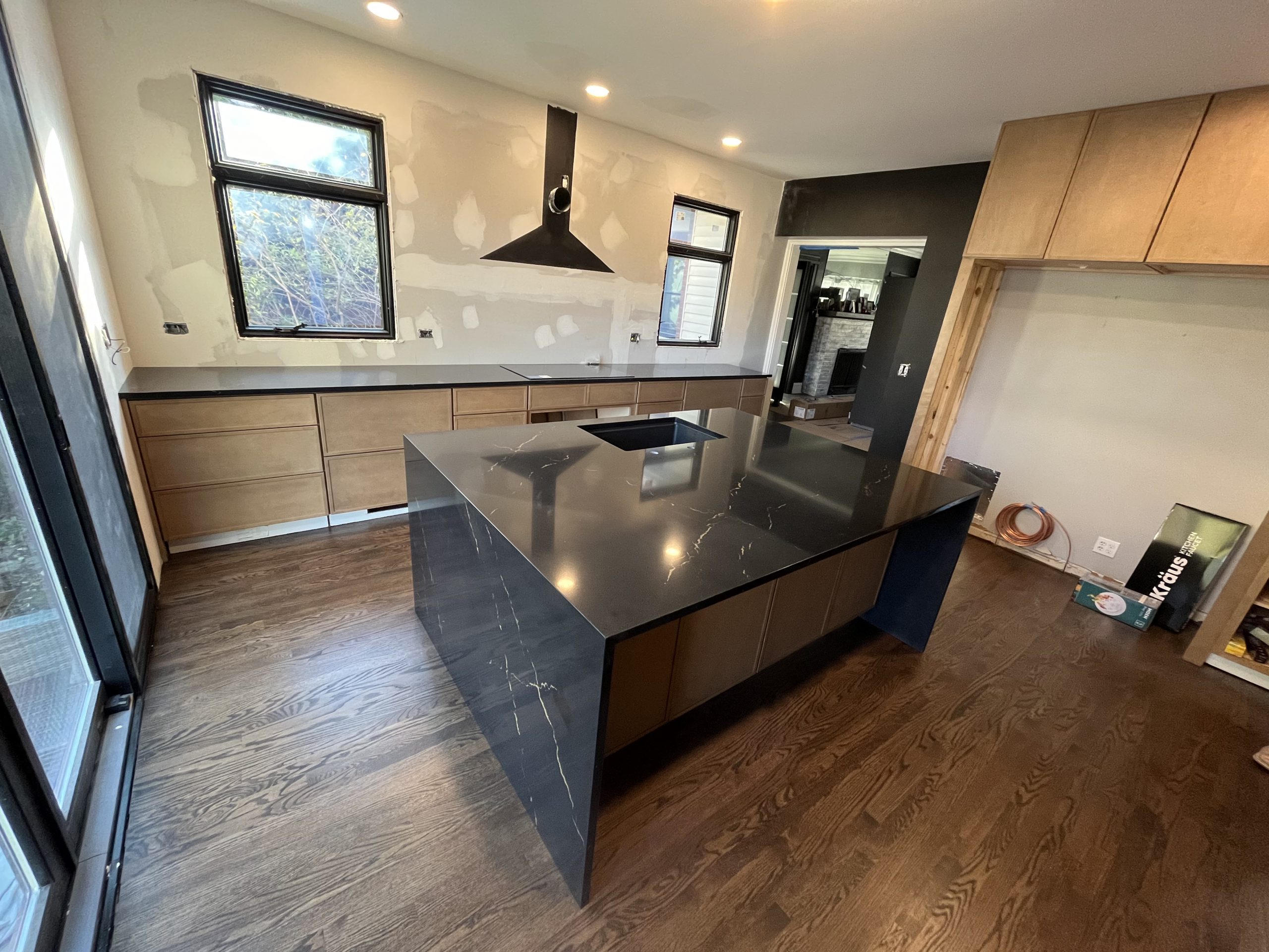 Modern kitchen with black stone countertops fabricated by STONELUX